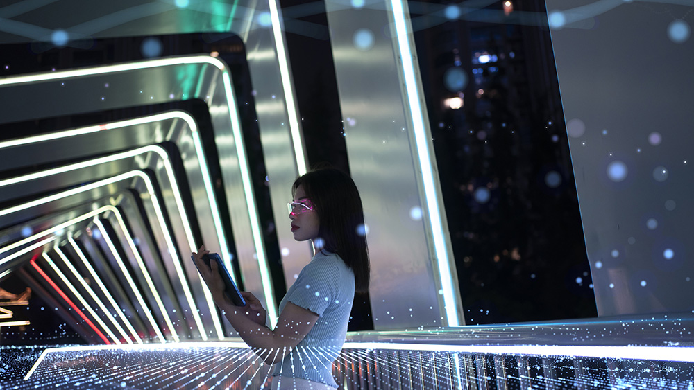 ALT Text: a Artificial Reality tunnel with a woman in the middle working on a tablet 